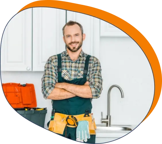 A handyman standing in a kitchen