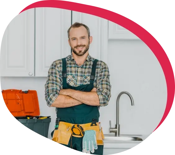 A handyman standing in a kitchen