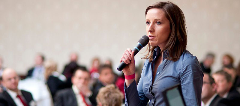 a consultant speaking at an event